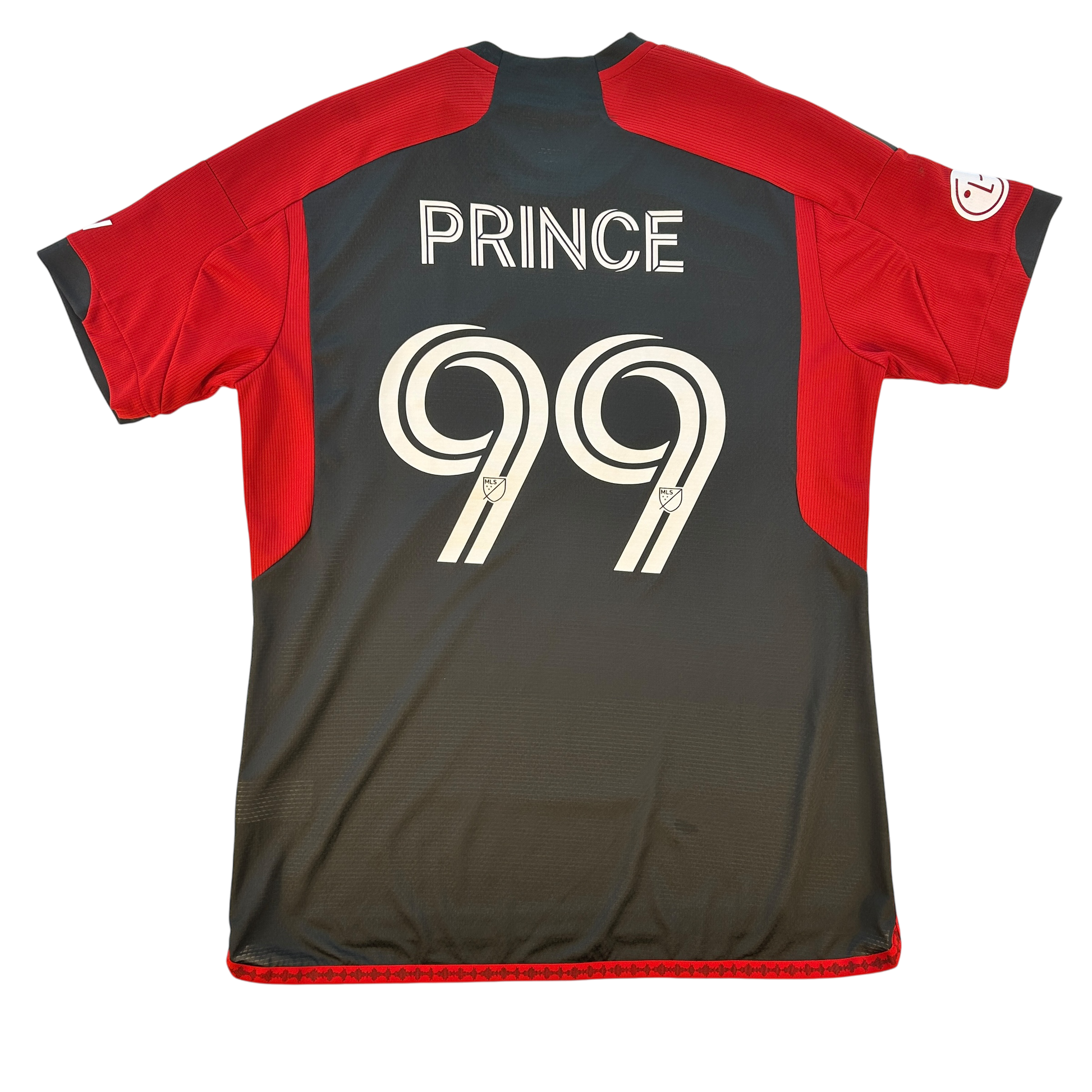 Toronto FC player issue home shirt with the name 'PRINCE' and the number '99' on the back in red and black colors