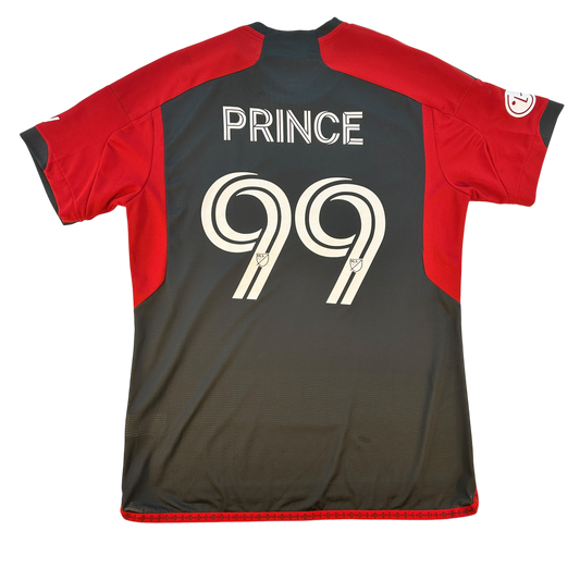 Toronto FC player issue home shirt with the name 'PRINCE' and the number '99' on the back in red and black colors