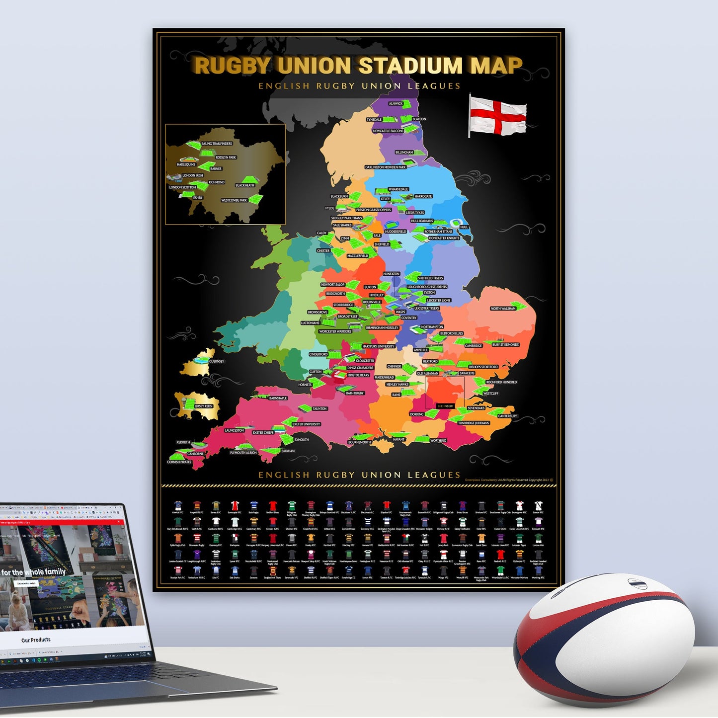 Map of English Rugby Union Leagues on a wall with a laptop and rugby ball on a table.