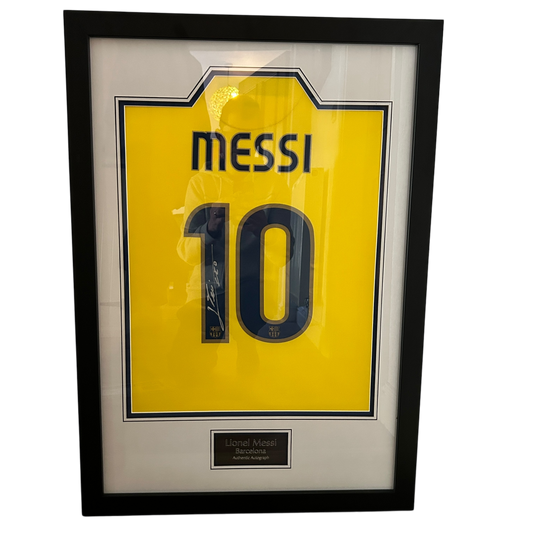 Lionel Messi 2008/2009 Signed Framed Shirt. A yellow away shirt that Leo Messi has signed on the number 1