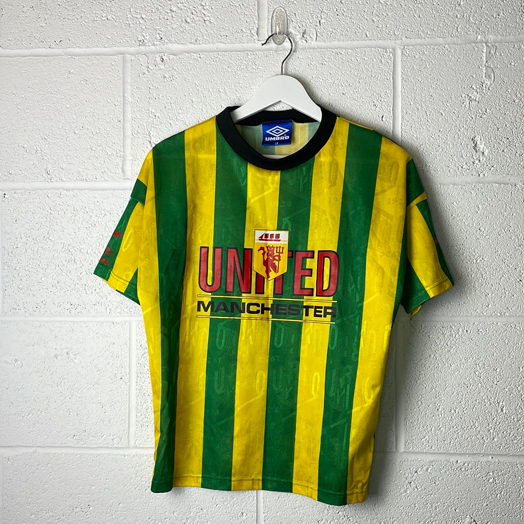 Manchester united green deals and gold shirt