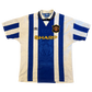 Vintage sports jersey with blue and white stripes, featuring logos and text on a white background. Yellow SHARP sponsor
