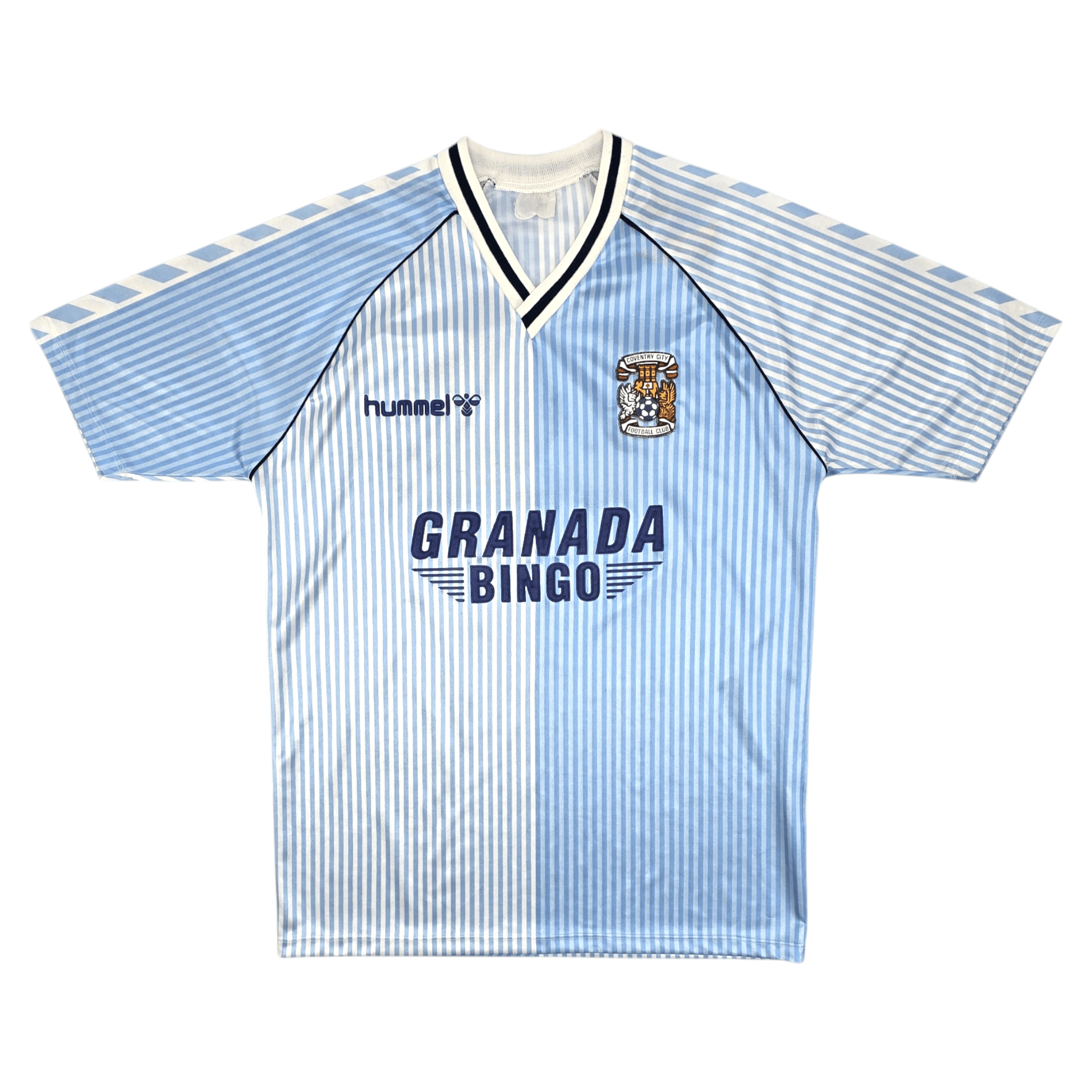 Light blue and white striped sports jersey with 'hummel' logo and 'Granada Bingo' text on a white background 