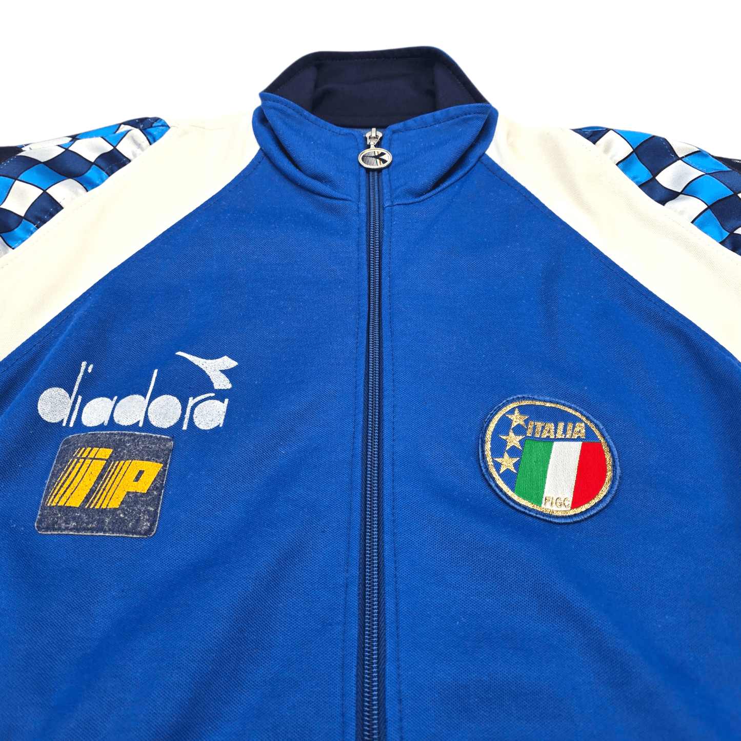 Blue tracksuit jacket with Diadora logo and Italian flag patch on a white background