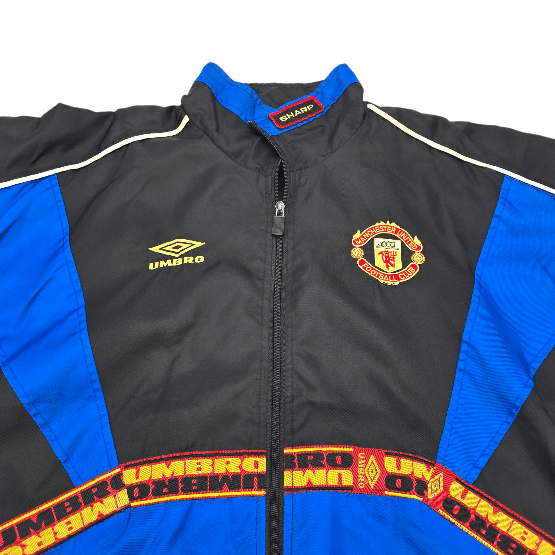 Black and blue jacket with Manchester United and Umbro logos on a white background