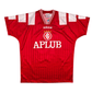 Red sports jersey with Adidas logo and 'APlub' branding on a white background