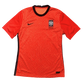 Red Korean football jersey with black accents on a gray background