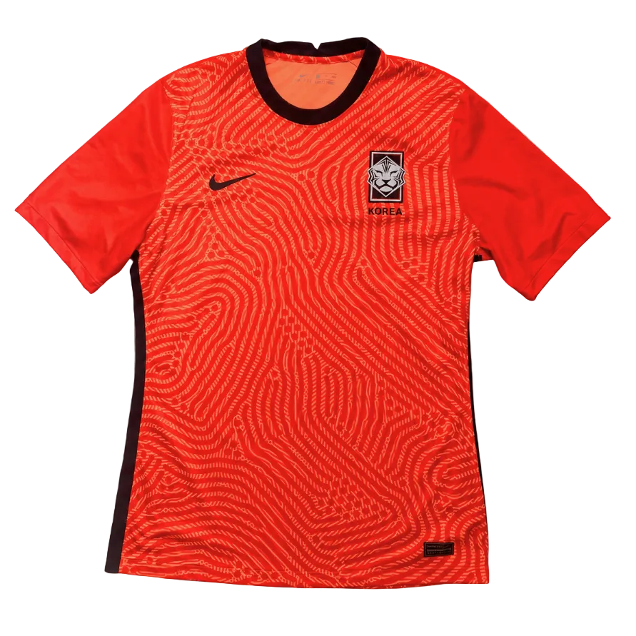 Red Korean football jersey with black accents on a gray background
