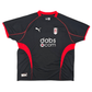 Black sports jersey with red accents featuring Puma logo and 'dabs.com' text on a white background