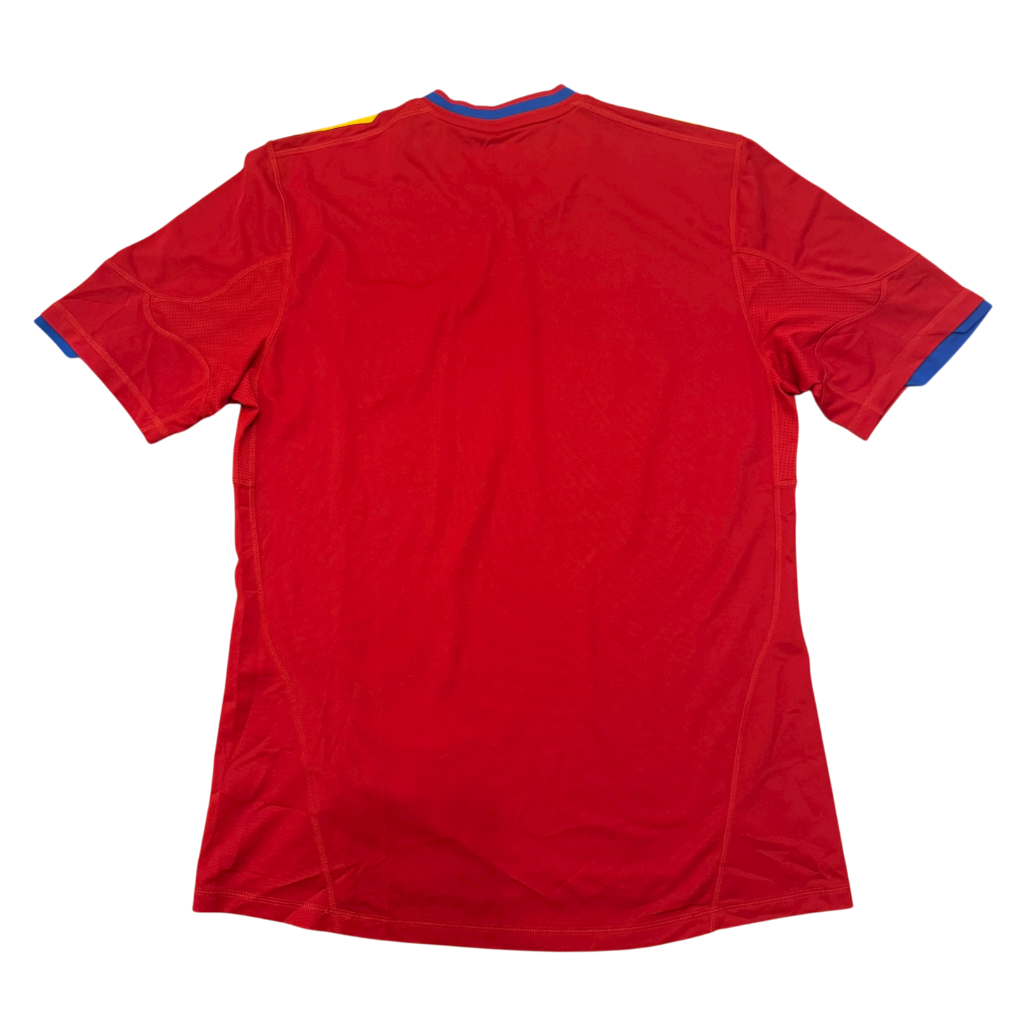 The back of a Spain 2010 jersey on a white background
