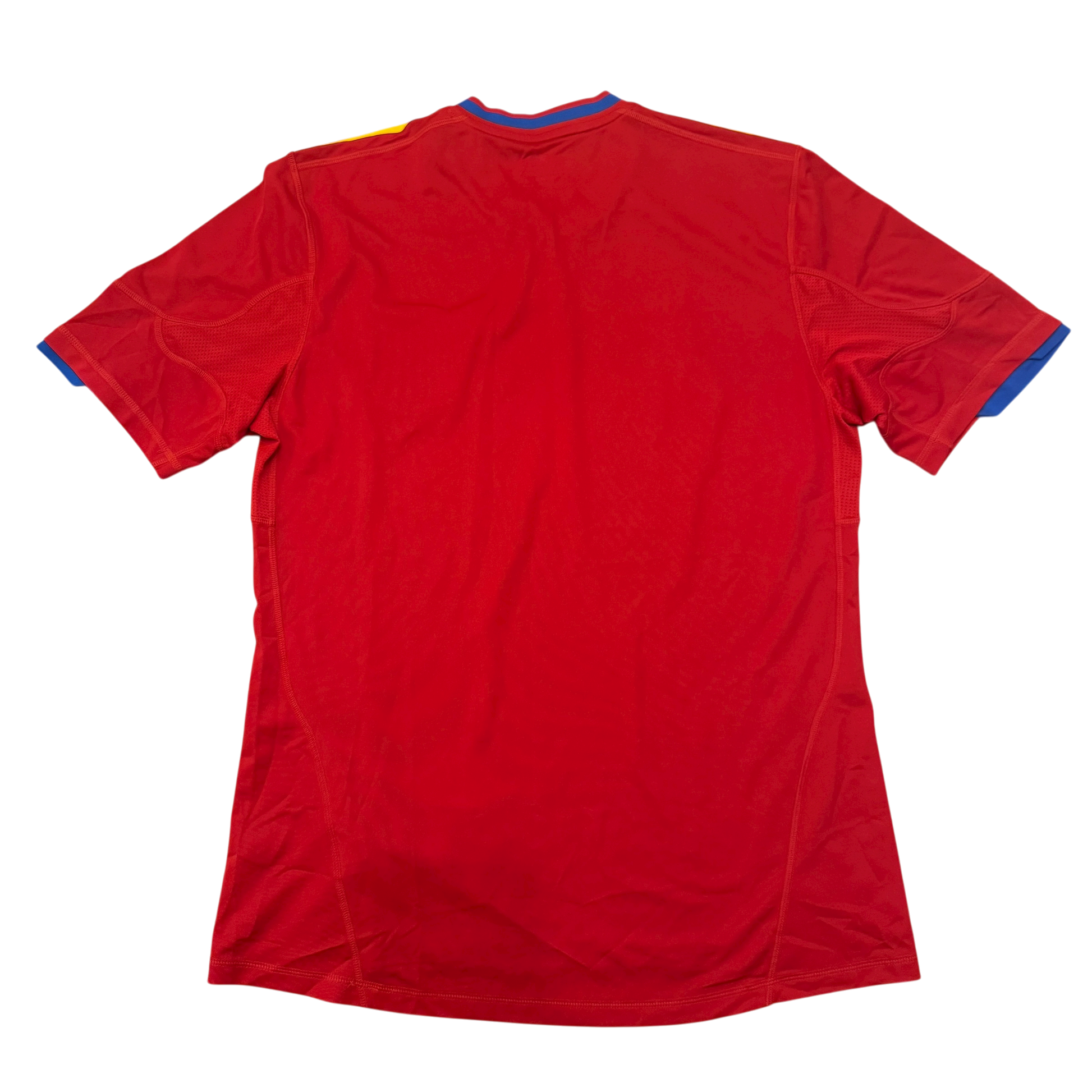The back of a Spain 2010 jersey on a white background