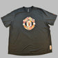 Manchester United Chinese New Year 2022 T-Shirt front featuring the Manchester United badge with a Chinese pattern 