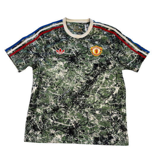 Camouflage-patterned Stone Roses t-shirt with Adidas and Manchester United logos on a white background