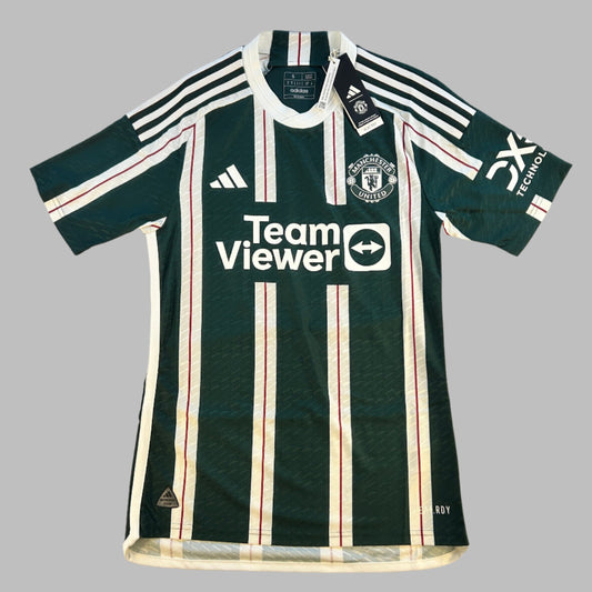 Manchester United 2023-2024 Authentic Away Shirt - Front with Team Viewer sponsor. This is a dark green shirt with think white stripes, in the white stripes there is a thinner red stripe. 