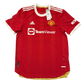 Red Manchester United 2021-2022 Authentic Home jersey with visible branding on a white background