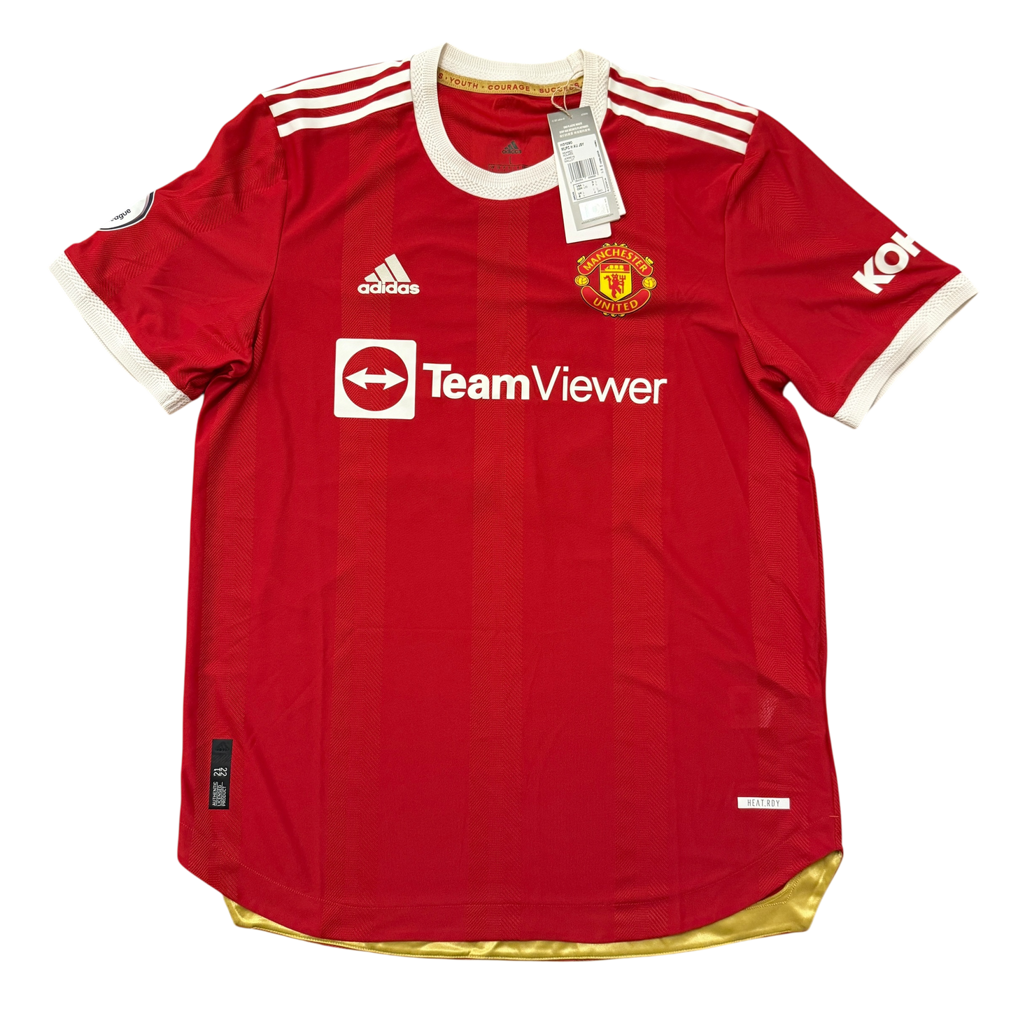 Red Manchester United 2021-2022 Authentic Home jersey with visible branding on a white background