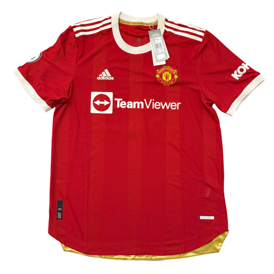 Red Manchester United 2021-2022 Authentic Home jersey with visible branding on a white background
