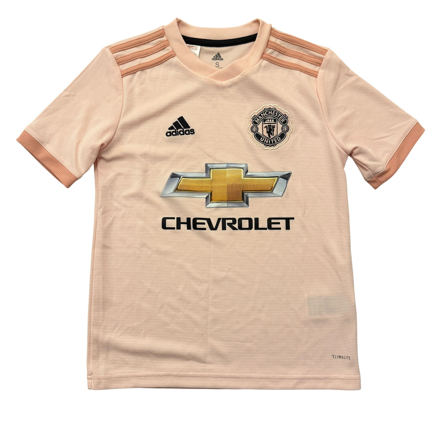 Pink Manchester United 2018/2019 youth Away jersey with Adidas, Manchester United, and Chevrolet logos on a white background