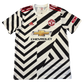 Black and white striped Manchester United 2020-2021 Third jersey with Adidas, Manchester United, and Chevrolet logos on a white background