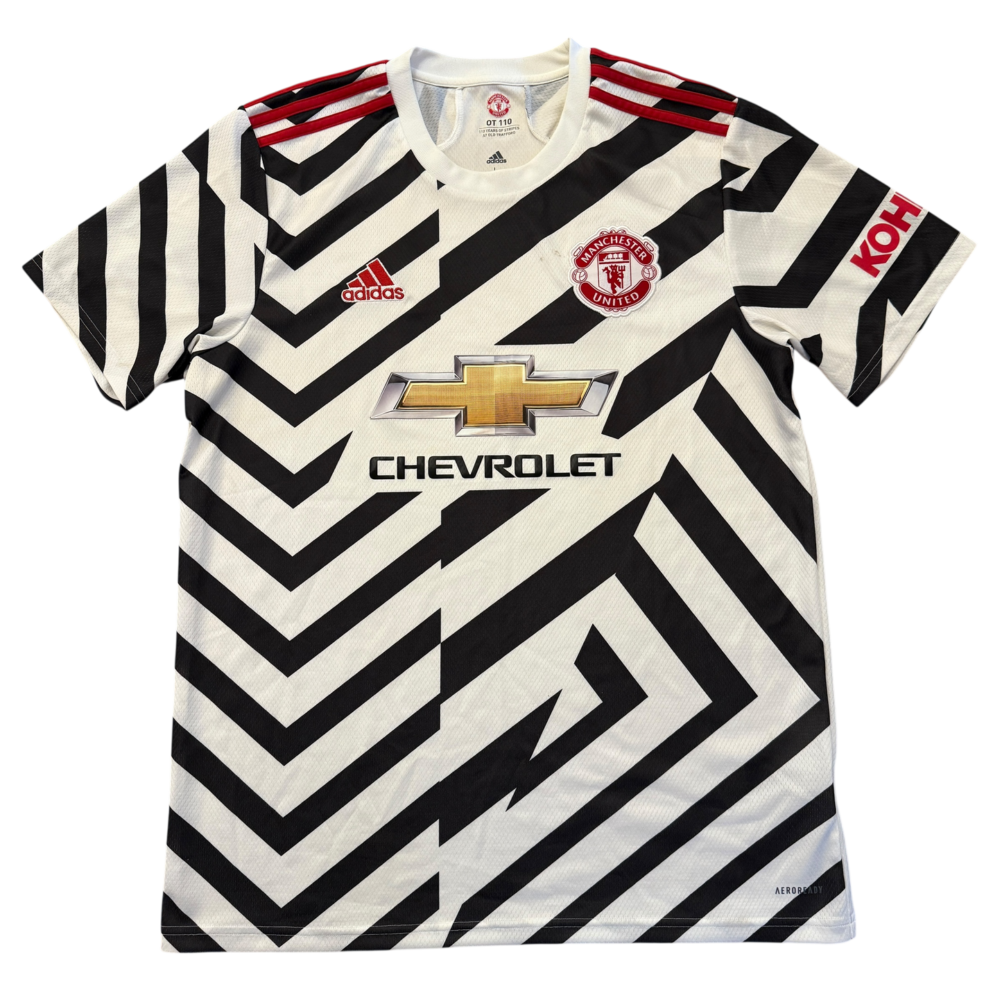 Black and white striped Manchester United 2020-2021 Third jersey with Adidas, Manchester United, and Chevrolet logos on a white background