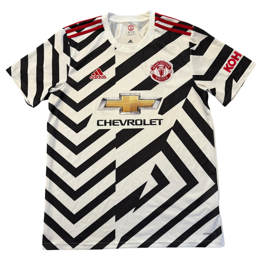 Black and white striped Manchester United 2020-2021 Third jersey with Adidas, Manchester United, and Chevrolet logos on a white background