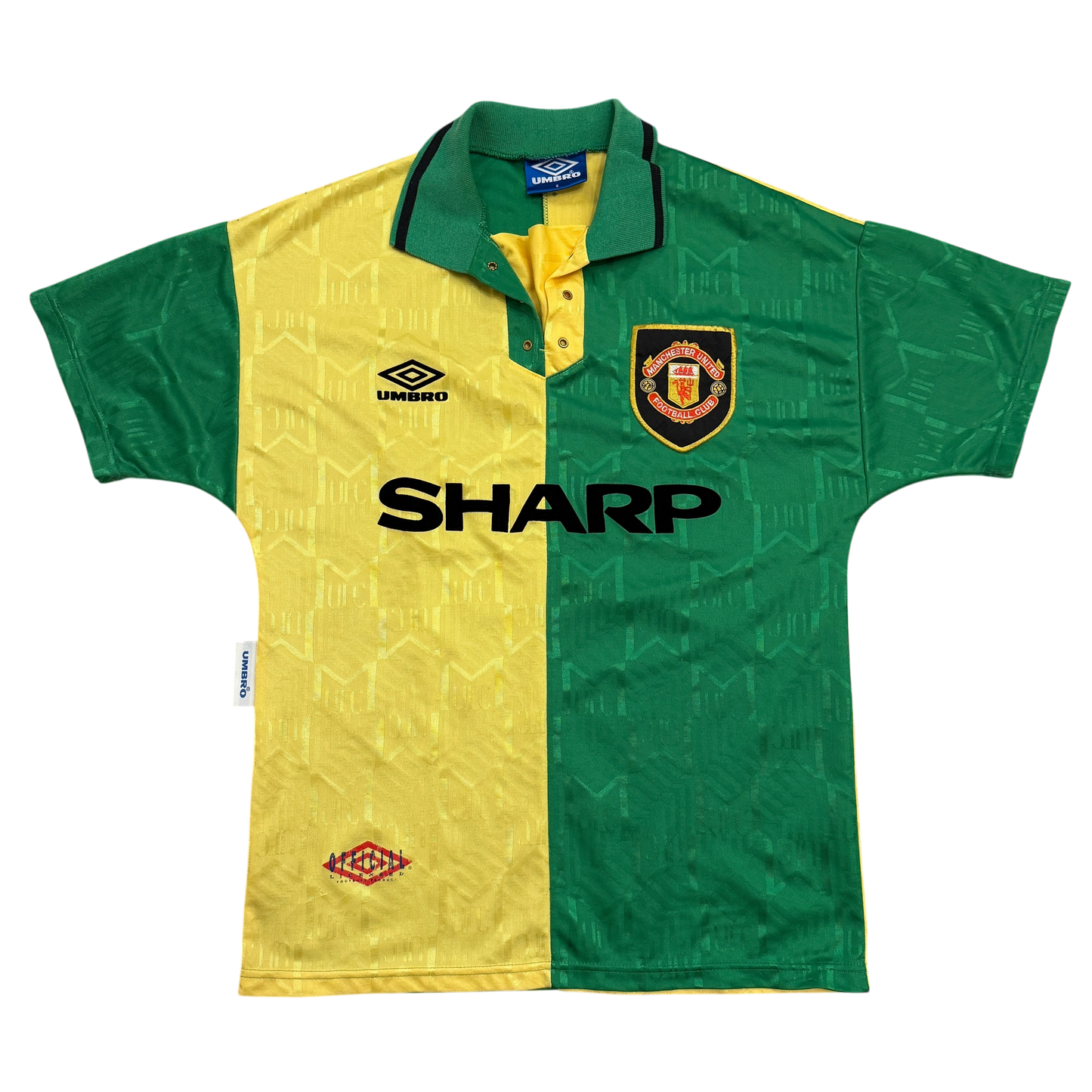 Green and yellow sports jersey with Manchester United logo and Umbro branding on a white background - The Manchester United 1992/1993/1994 Third Shirt