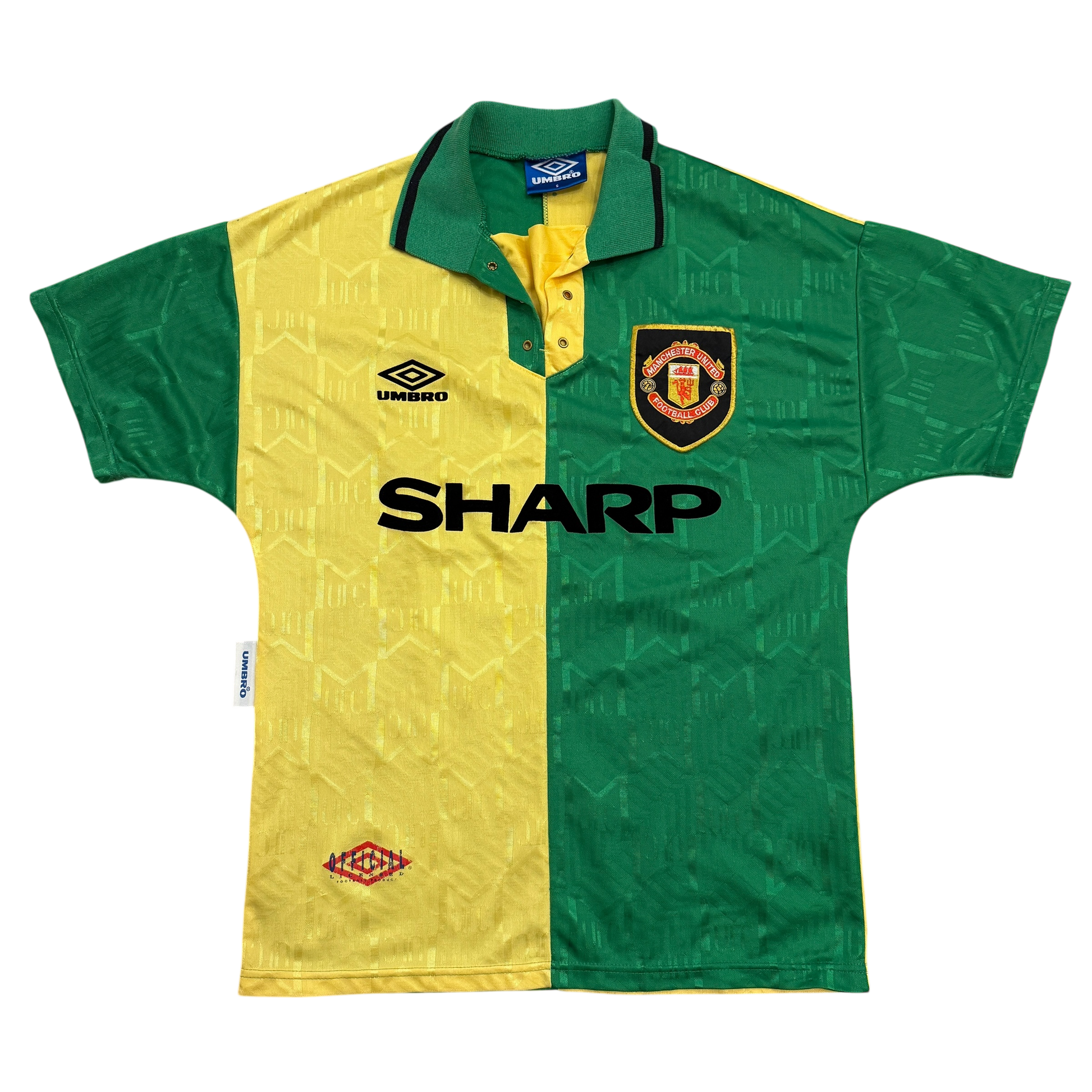 Green and yellow sports jersey with Manchester United logo and Umbro branding on a white background - The Manchester United 1992/1993/1994 Third Shirt