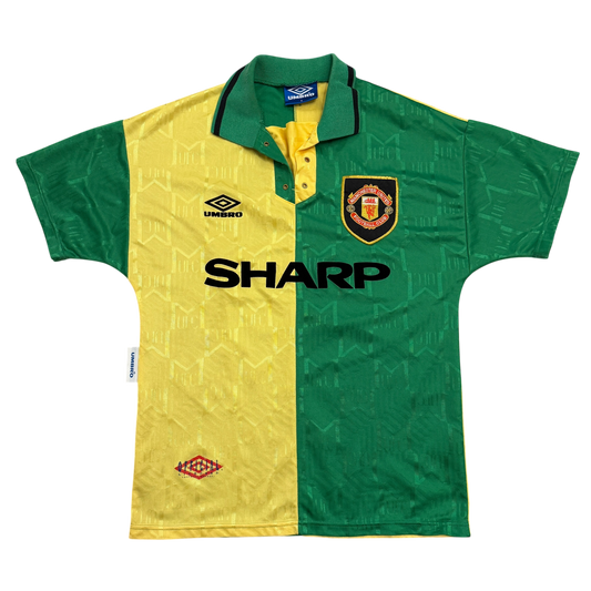 Green and yellow sports jersey with Manchester United logo and Umbro branding on a white background - The Manchester United 1992/1993/1994 Third Shirt