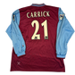 Maroon sports jersey with 'Carrick 21' on a white background