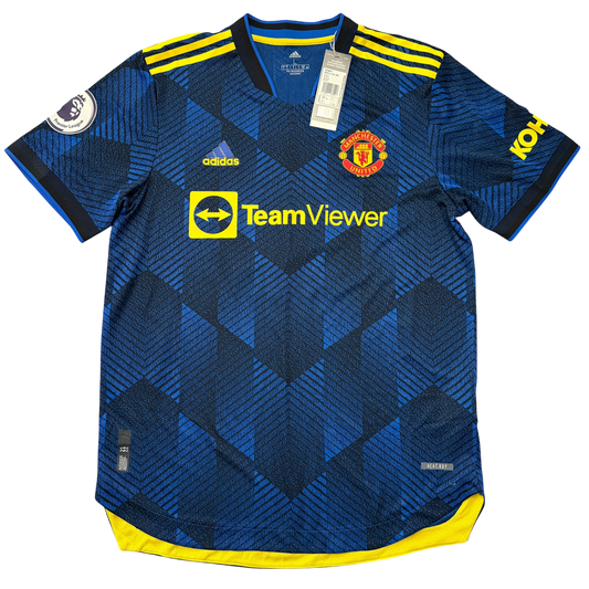 Blue Manchester United 2021/2022 HEAT.RDY Thirdjersey with yellow accents and branding on a white background