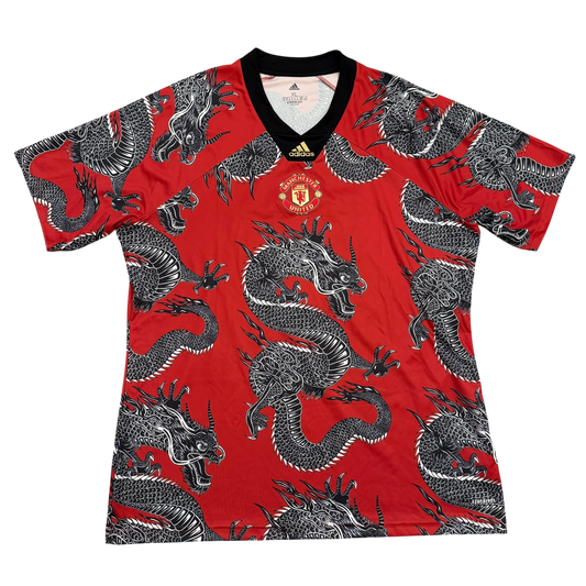 Red sports jersey with dragon pattern and Adidas logo on a white background - Manchester United 2020 Chinese New Year Shirt