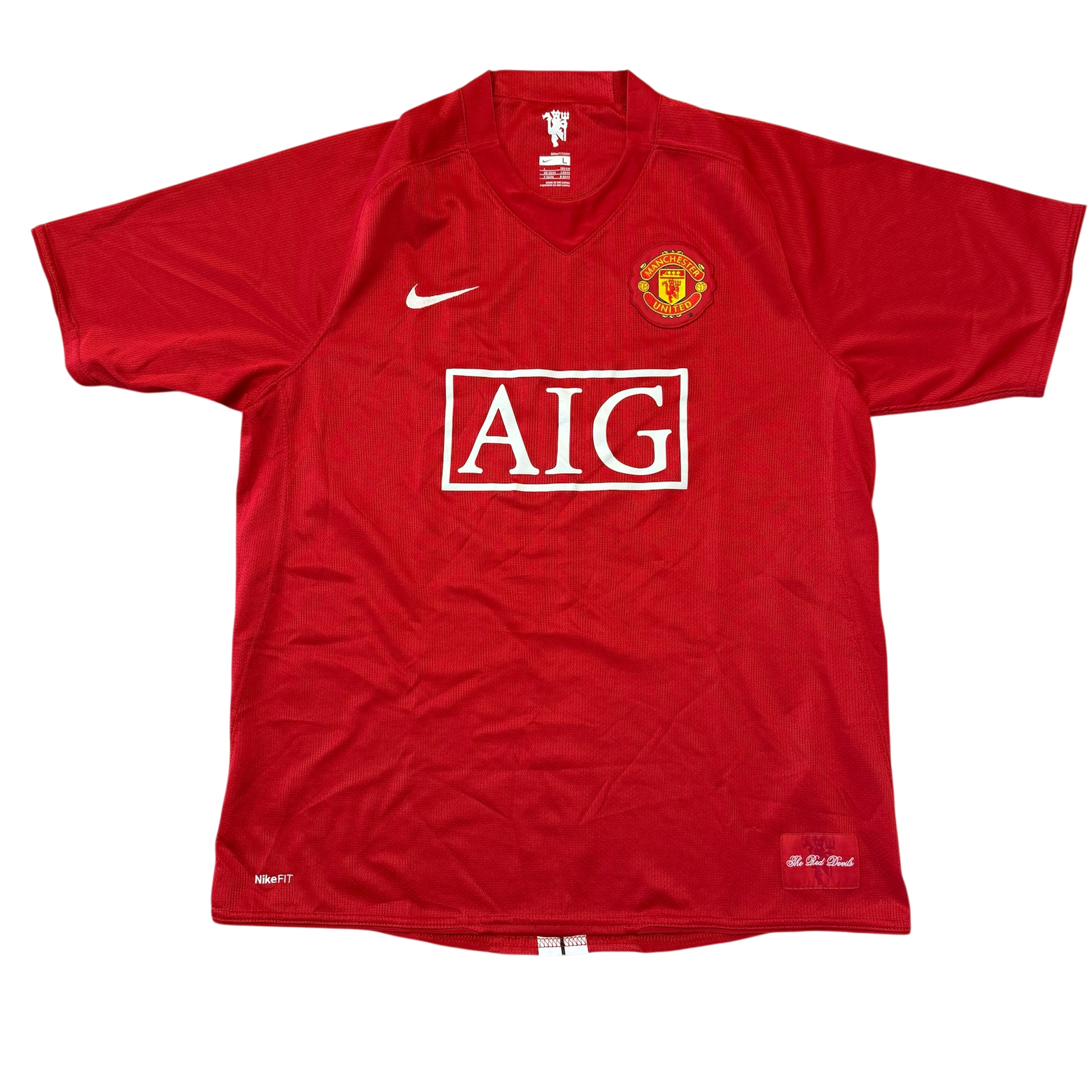 Red Manchester United 2007/2008 Home jersey with AIG logo and Manchester United emblem on a white background