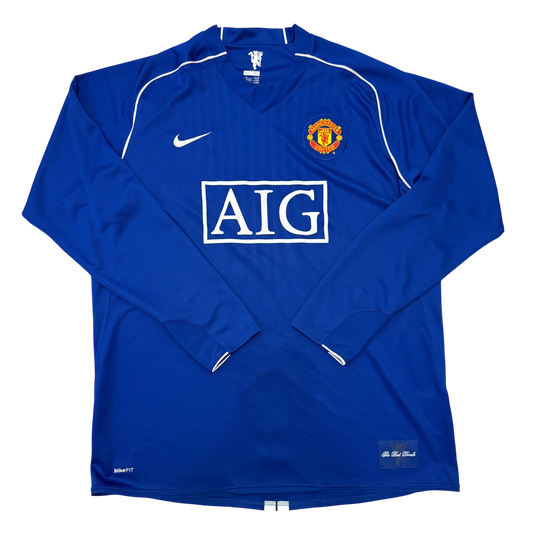 Blue 2008 goalkeeper jersey with AIG logo and Manchester United emblem on a white background
