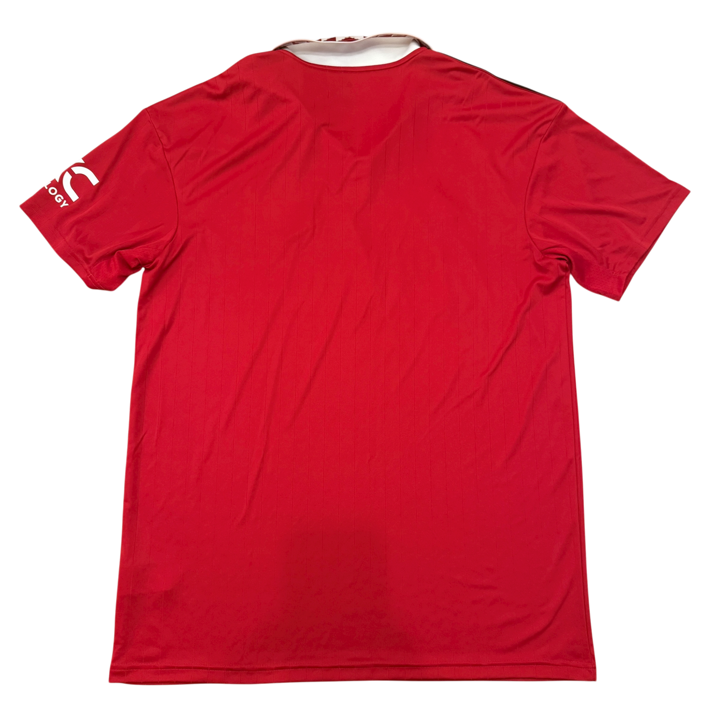 Red sports jersey with a brand logo on the sleeve against a white background