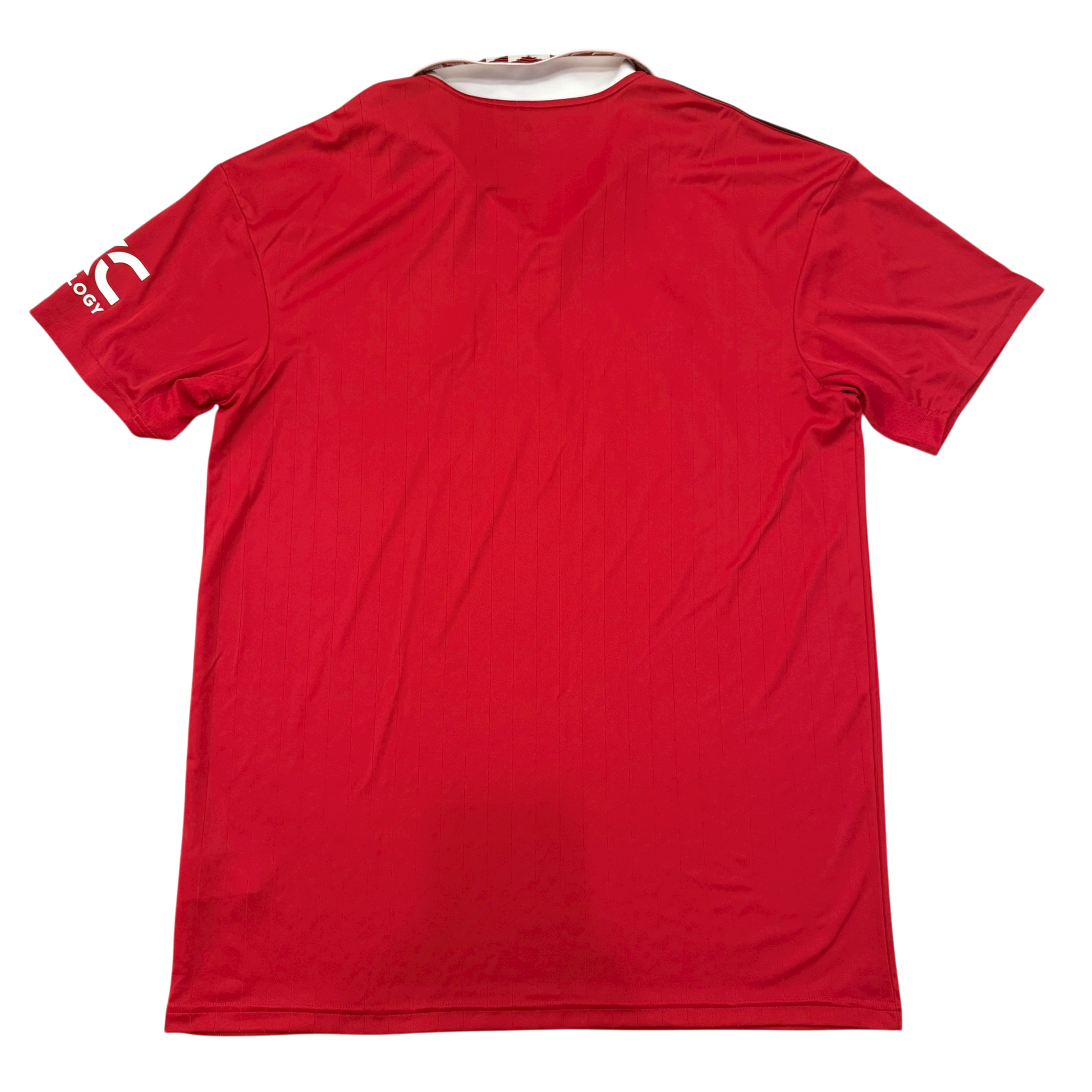 Red sports jersey with a brand logo on the sleeve against a white background