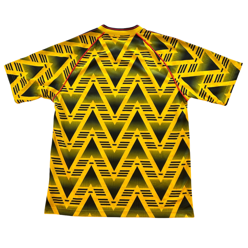 Yellow and black geometric patterned t-shirt on a white background