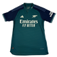 Green Arsenal 23/24 away player issue jersey with Emirates branding on a white background