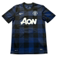 Checkered blue and black Manchester United 2013/14 Away jersey with AON branding in white on a white background