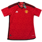 Red Manchester United 2023-2024 Player Issue Home jersey with Adidas and Manchester United logos on a white background