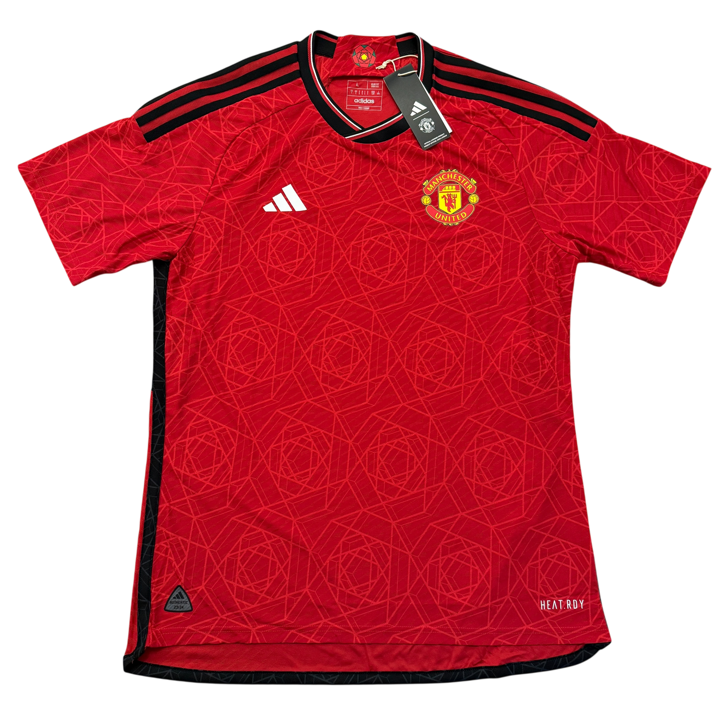 Red Manchester United 2023-2024 Player Issue Home jersey with Adidas and Manchester United logos on a white background