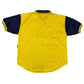 Yellow sports jersey with navy sleeves on a white background