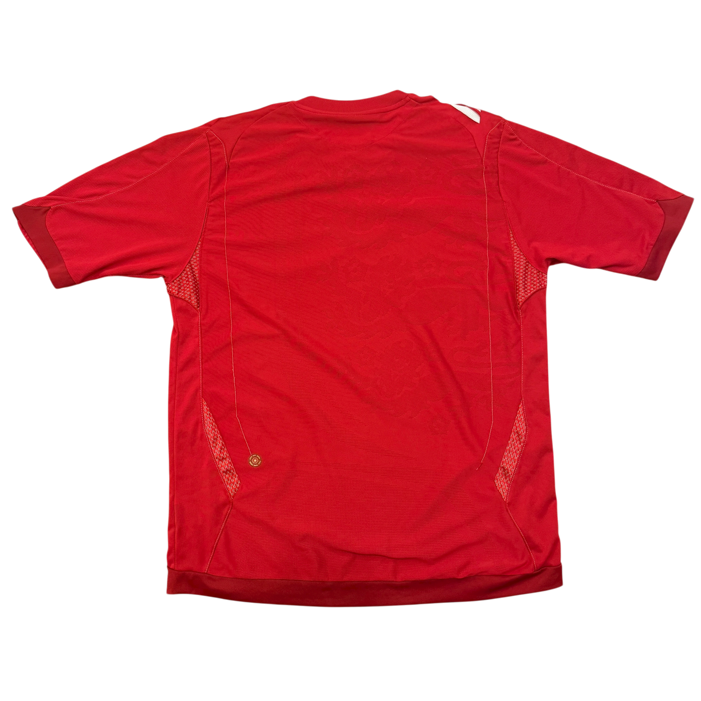The back of the England 2006 Away Shirt - an red jersey with 3 lions in the material 