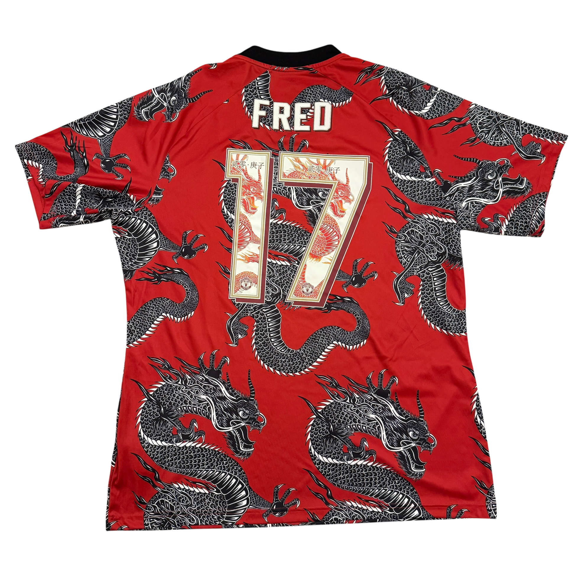 Red sports jersey with black dragon patterns and 'FRED' branding on a white background