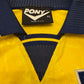 Close-up of a yellow and blue garment with a Pony label
