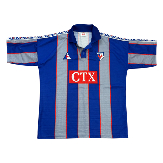 Blue and gray striped shirt with red and white 'CTX' logo. The Watford 1998/1999 Away Shirt front