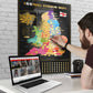 A person scratching off a map of football stadiums in England on a wall, with a laptop open on a desk.