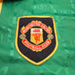 Manchester United Football Club logo on a green background