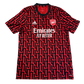 Red and black sports jersey with Emirates and Adidas logos on a white background