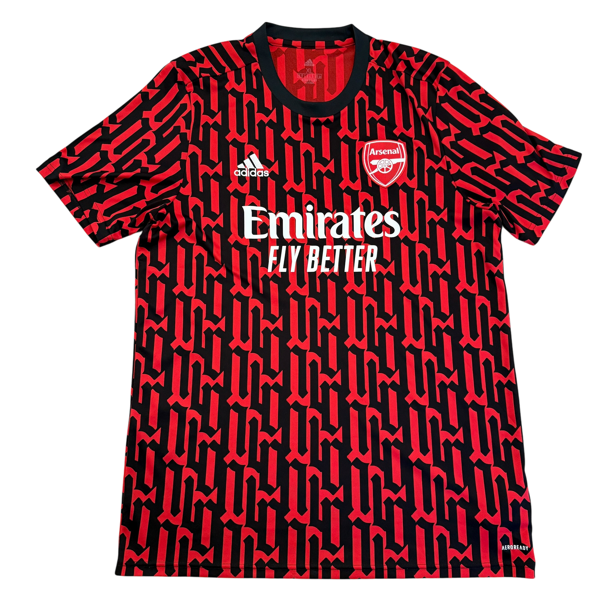 Red and black sports jersey with Emirates and Adidas logos on a white background