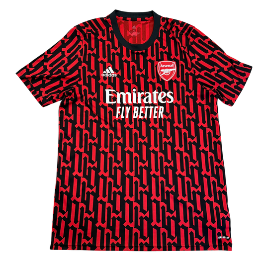 Red and black sports jersey with Emirates and Adidas logos on a white background